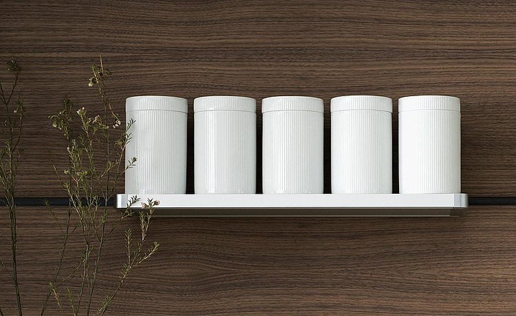 Round white storage jars in grooved porcelain. Understated, smart and functional