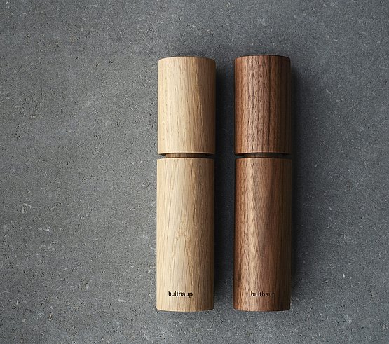 Minimalist and elegant:  cylindrical salt and pepper mills made from light and dark wood
